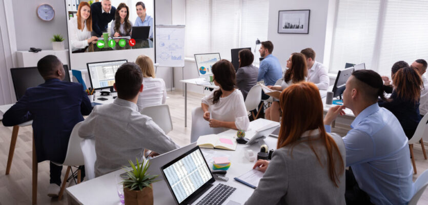 Businesspeople Attending Videoconference Meeting In Office