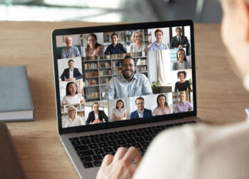 Female employee talk on video call with colleagues